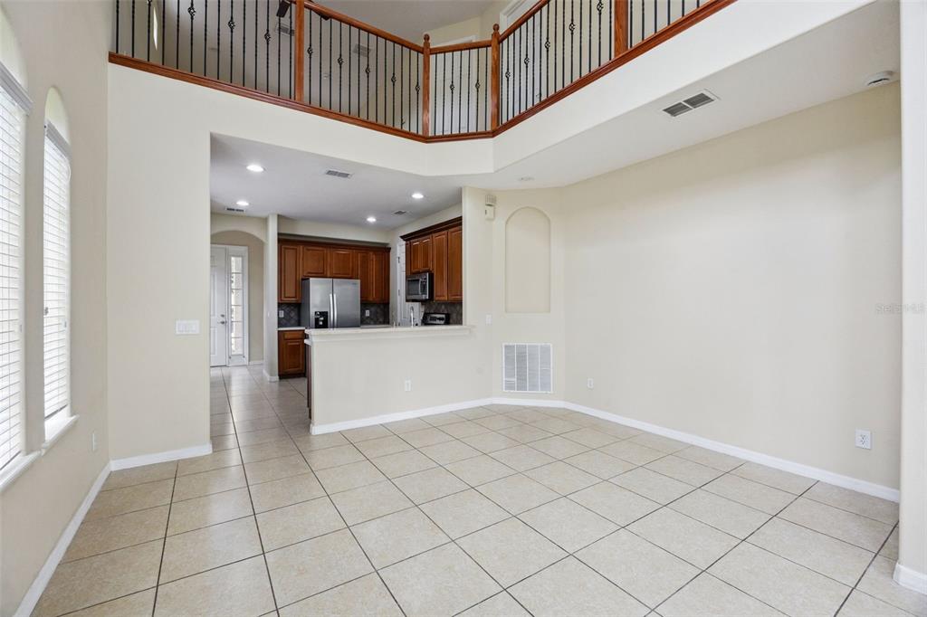 551 Terrace Spring Drive Orlando, FL 32828 - Photo 9 of 41 a view of an entryway with a kitchen