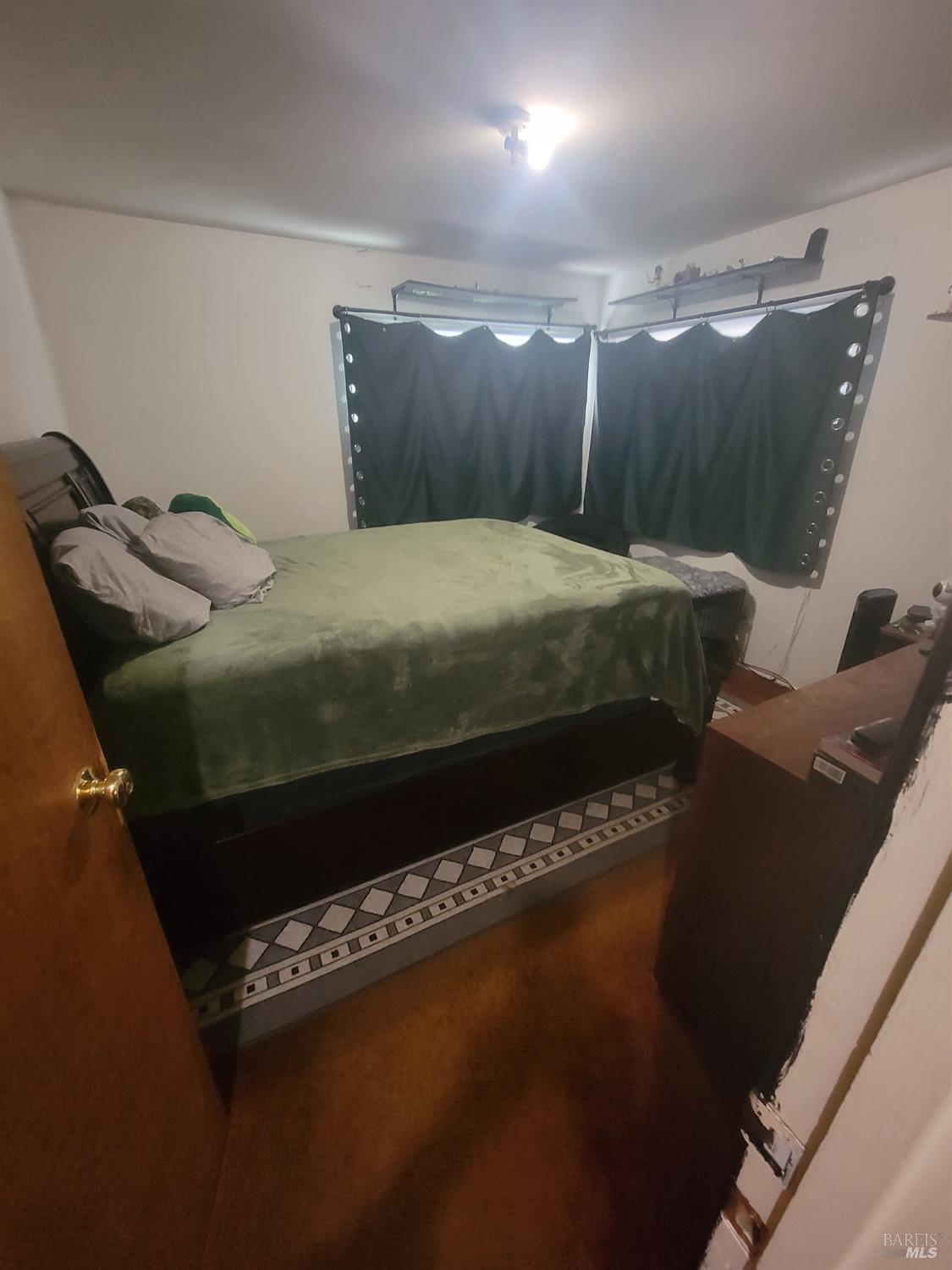 1005 Temple Avenue Santa Rosa, CA 95404 - Photo 18 of 20 a bed sitting in a bedroom next to a window