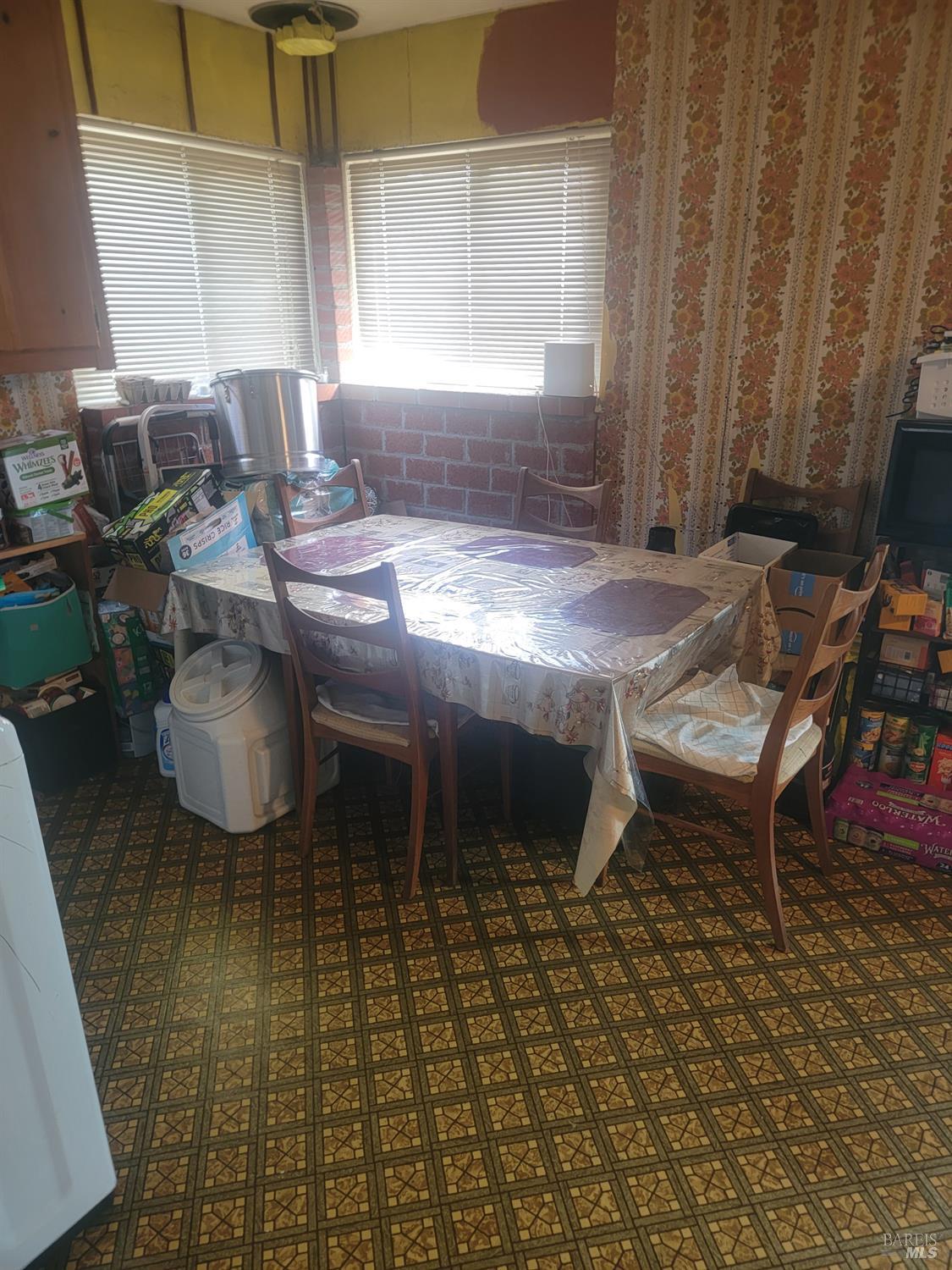 1005 Temple Avenue Santa Rosa, CA 95404 - Photo 9 of 20 a living room with a table and a fireplace