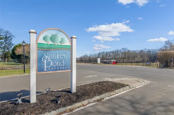 a view of a street sign next to a yard