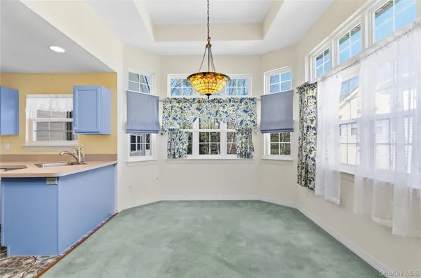 a view of a kitchen with granite countertop a stove top oven