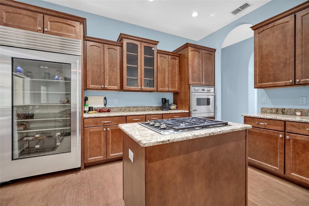 9824 Brantley Road Lithia, FL 33547 - Photo 11 of 38 a kitchen with stainless steel appliances granite countertop a stove and a sink