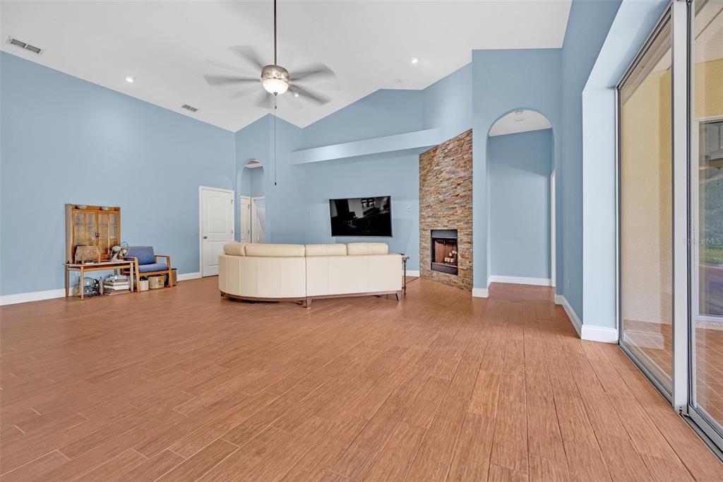 9824 Brantley Road Lithia, FL 33547 - Photo 14 of 38 a living room with furniture and a flat screen tv