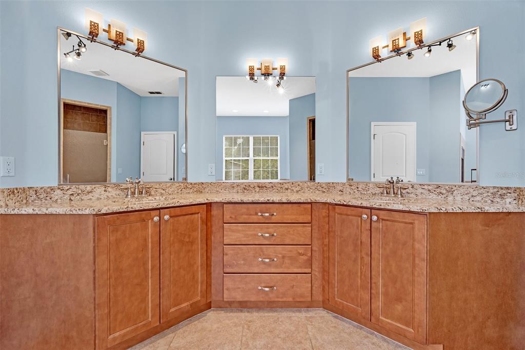 9824 Brantley Road Lithia, FL 33547 - Photo 20 of 38 a bathroom with a granite countertop sink and a mirror