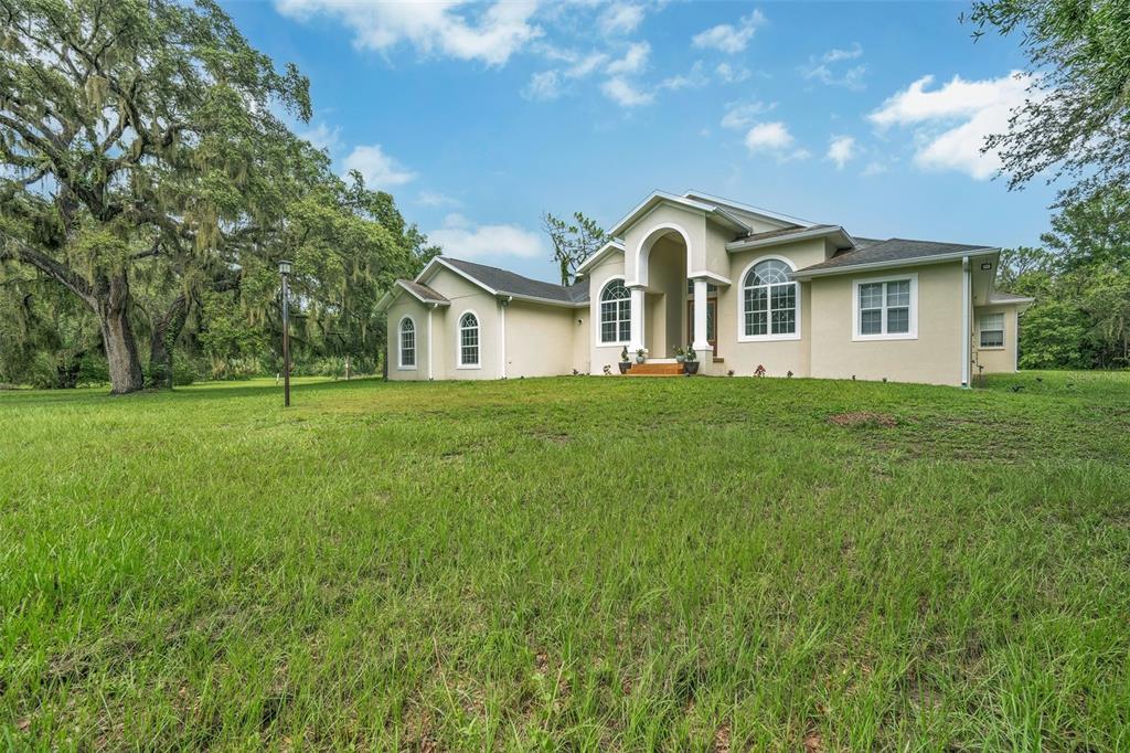 9824 Brantley Road Lithia, FL 33547 - Photo 2 of 38 a front view of a house with a yard