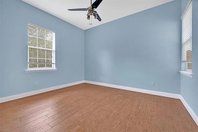 a view of a field with an trees