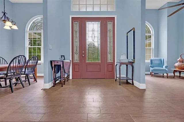 a view of a livingroom with furniture and a window