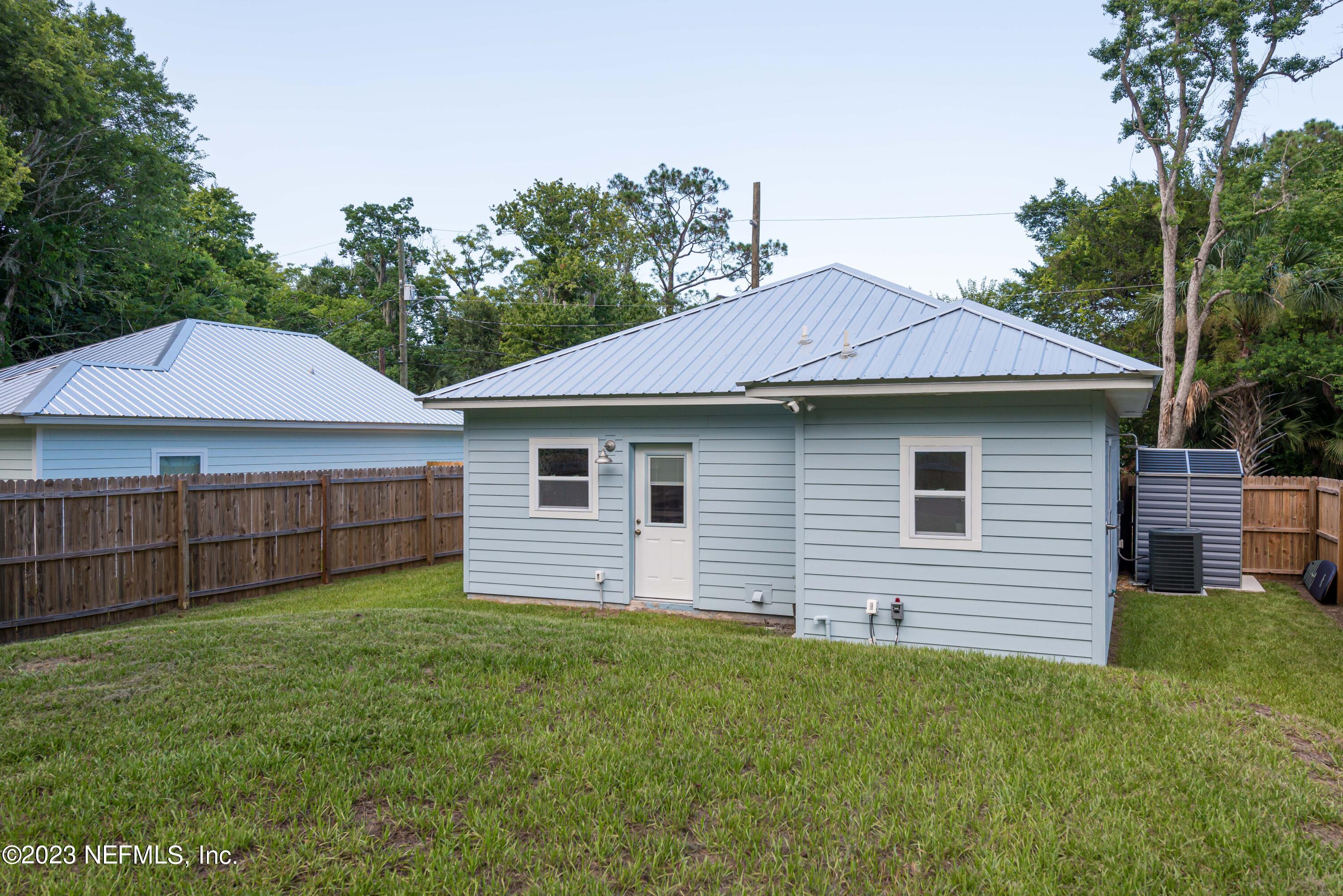461 Herbert Street St. Augustine, FL 32084 - Photo 13 of 15 a view of a house with a yard and sitting area