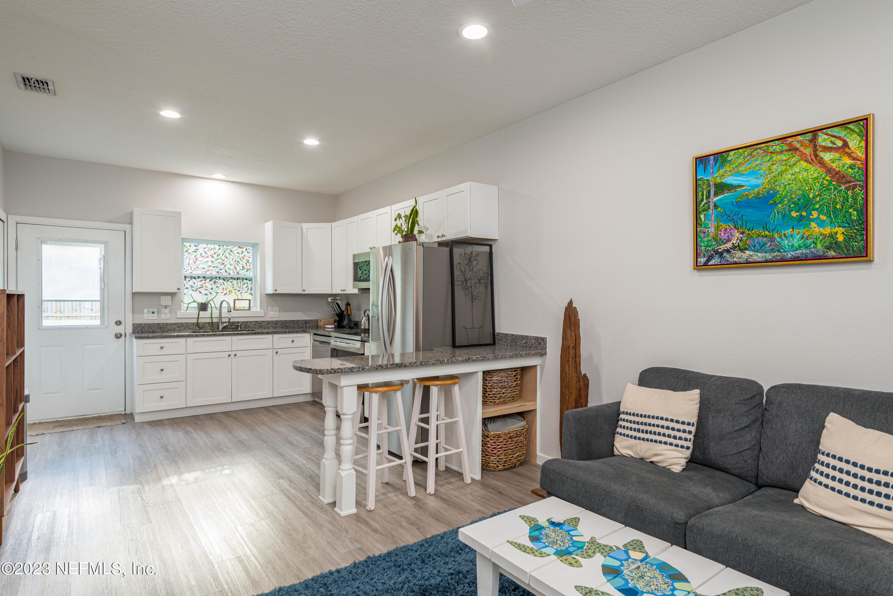461 Herbert Street St. Augustine, FL 32084 - Photo 2 of 15 a living room with furniture and kitchen view