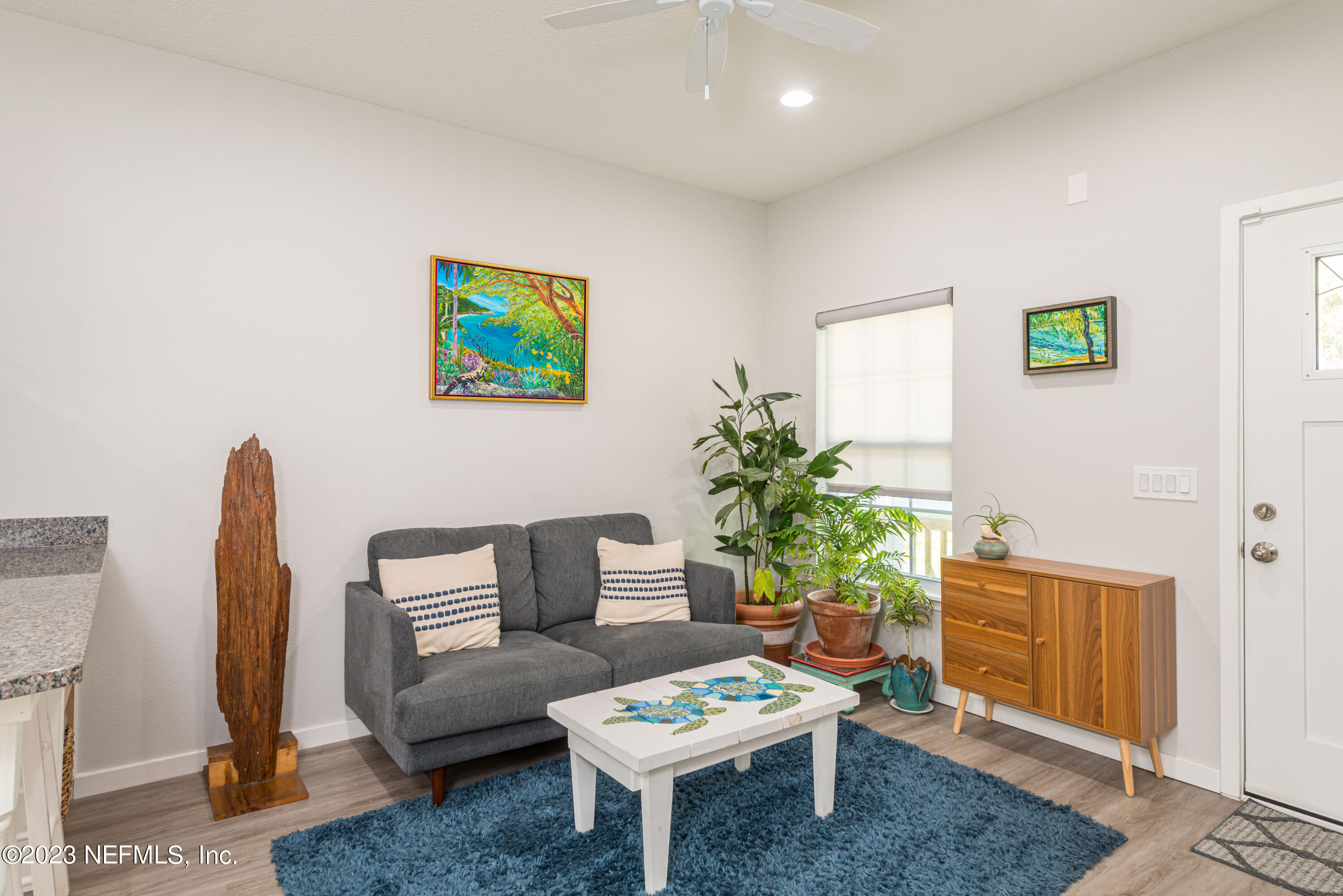 461 Herbert Street St. Augustine, FL 32084 - Photo 3 of 15 a living room with furniture a rug and a potted plant