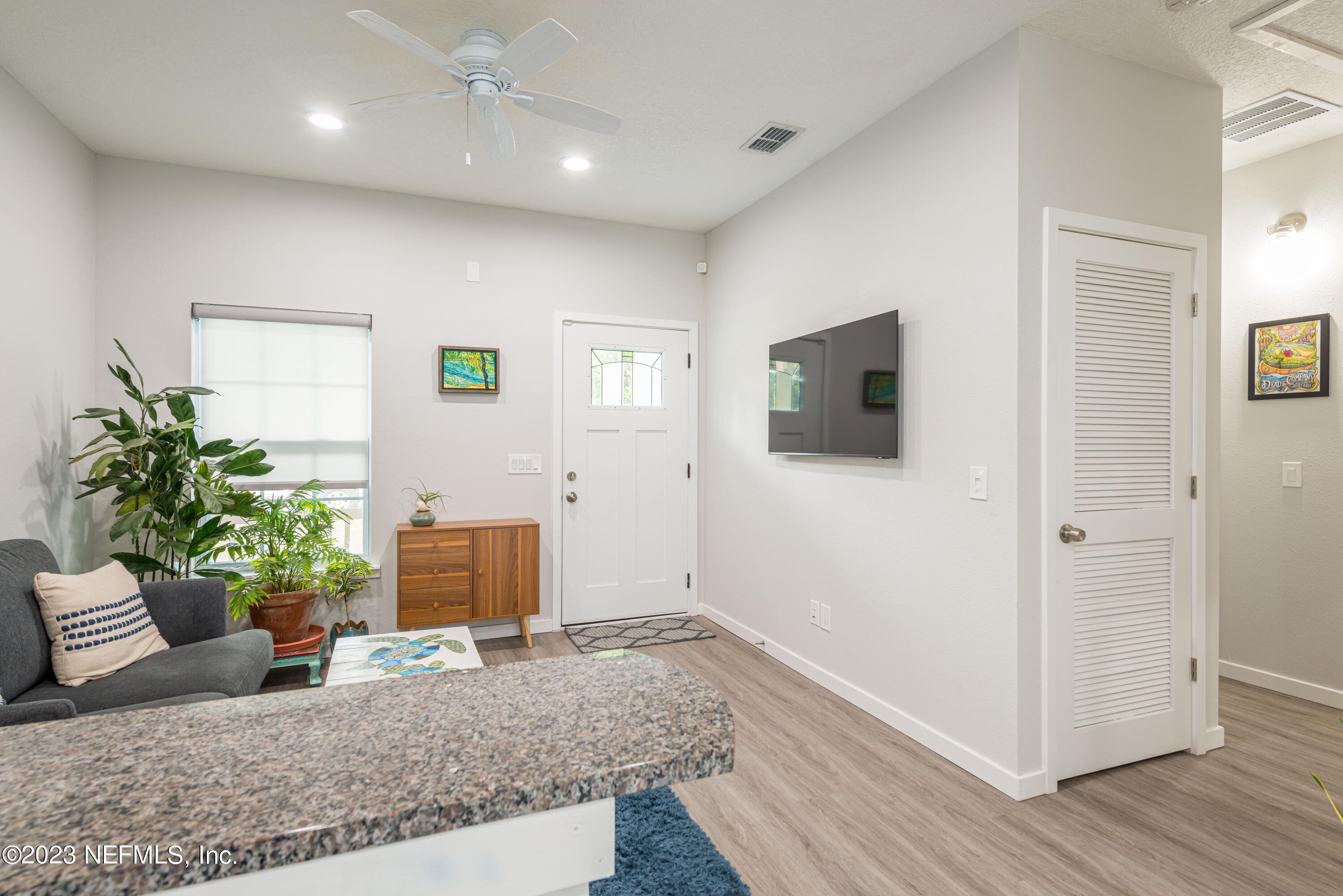 461 Herbert Street St. Augustine, FL 32084 - Photo 5 of 15 a living room with furniture and a flat screen tv