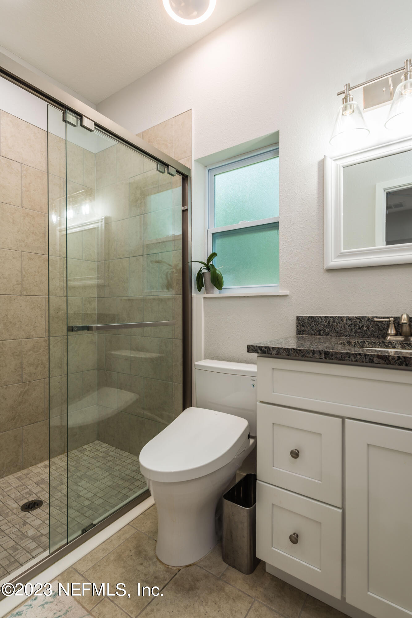 461 Herbert Street St. Augustine, FL 32084 - Photo 9 of 15 a bathroom with a shower a toilet and sink