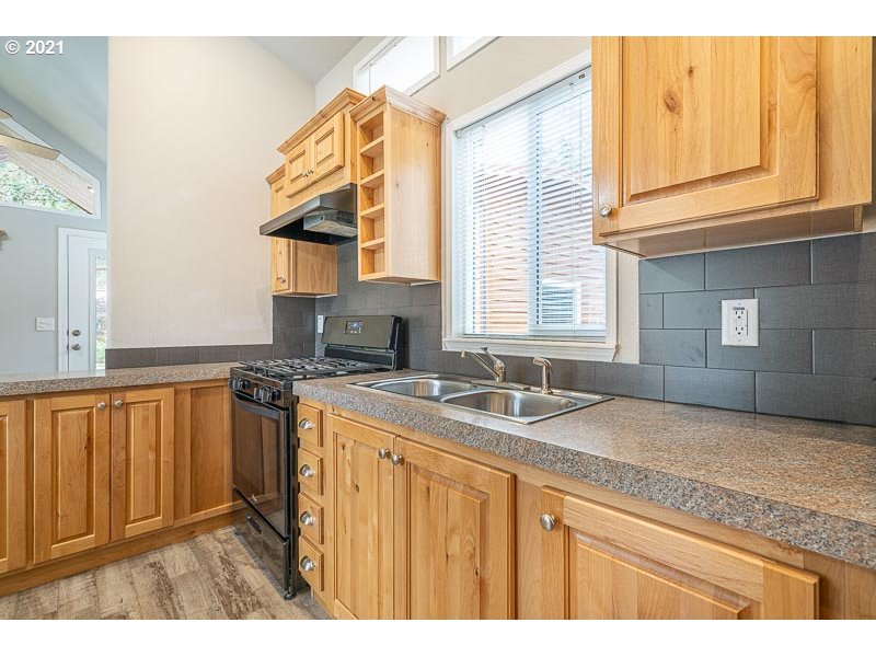 8372 Enchanted Way Southeast, Unit 192 Turner, OR 97392 - Photo 12 of 27 a kitchen with a sink stove and cabinets