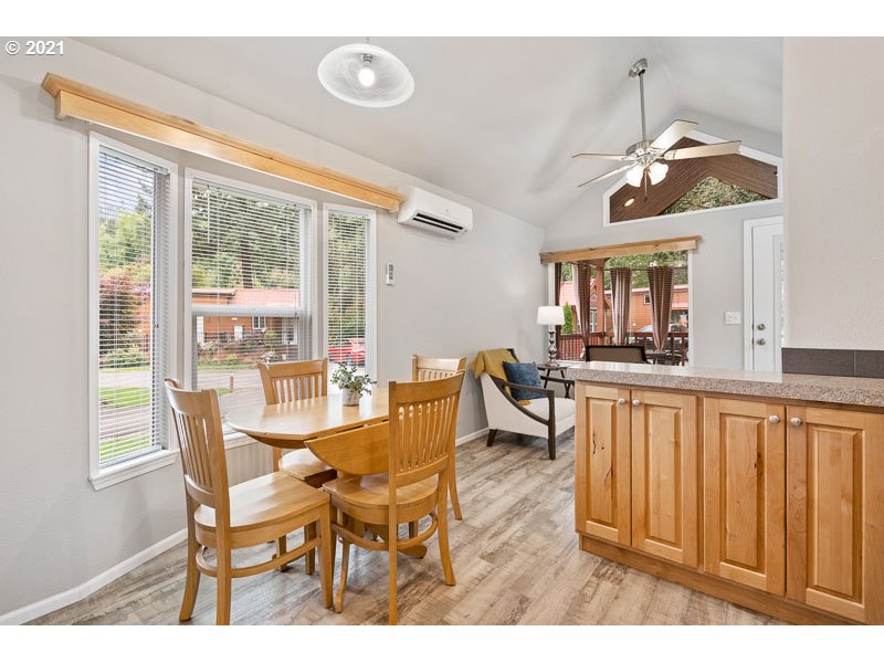 8372 Enchanted Way Southeast, Unit 192 Turner, OR 97392 - Photo 13 of 27 a view of a dining room with furniture window and wooden floor