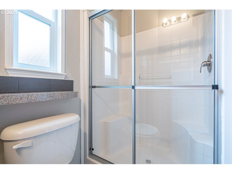 8372 Enchanted Way Southeast, Unit 192 Turner, OR 97392 - Photo 16 of 27 a bathroom with a toilet and a shower