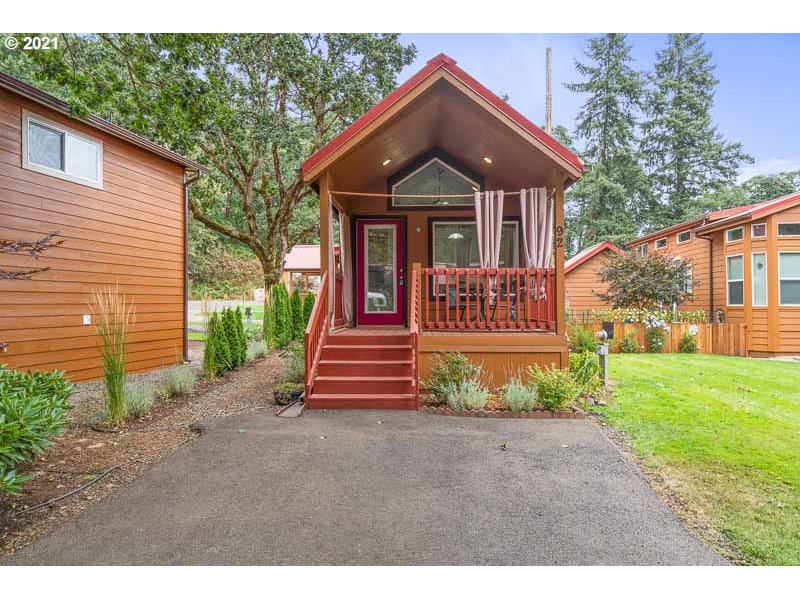 8372 Enchanted Way Southeast, Unit 192 Turner, OR 97392 - Photo 2 of 27 a front view of a house with a yard