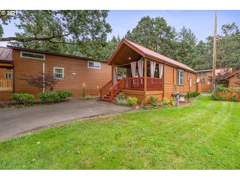 8372 Enchanted Way Southeast, Unit 192 Turner, OR 97392 - Photo 22 of 27 a front view of a house with garden