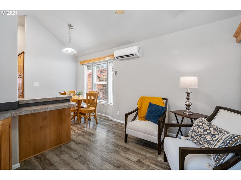 8372 Enchanted Way Southeast, Unit 192 Turner, OR 97392 - Photo 4 of 27 a living room with furniture and a wooden floor