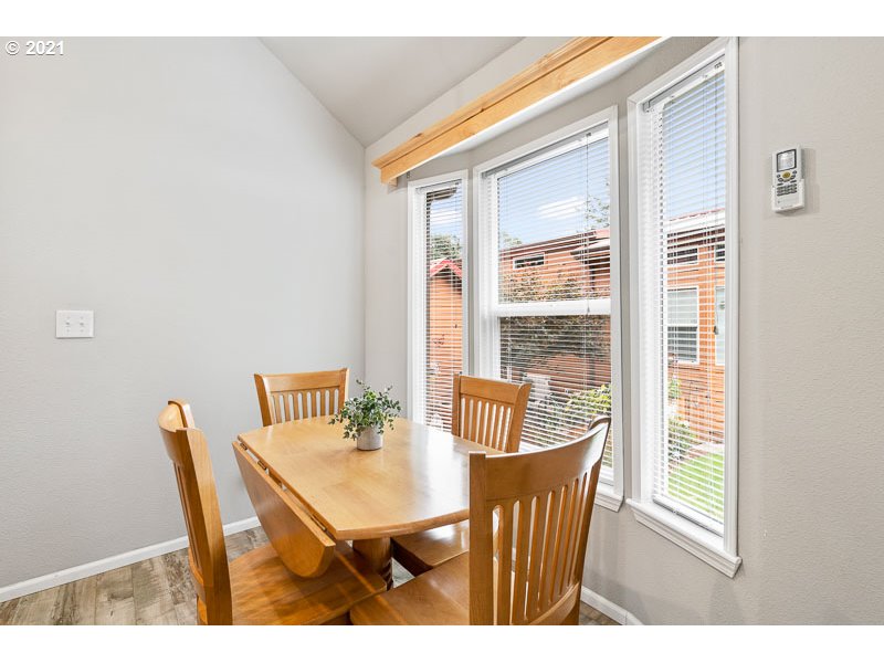 8372 Enchanted Way Southeast, Unit 192 Turner, OR 97392 - Photo 8 of 27 a view of a dining room with furniture window and outside view