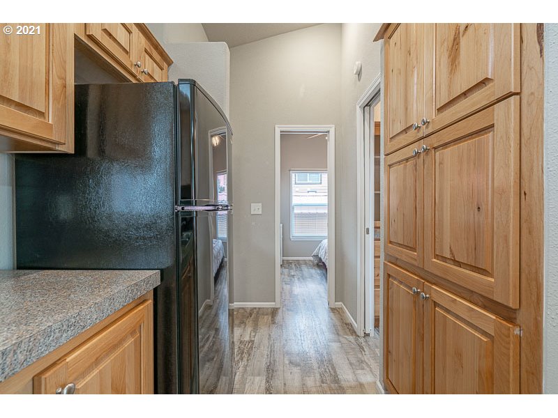 8372 Enchanted Way Southeast, Unit 192 Turner, OR 97392 - Photo 10 of 27 a kitchen with stainless steel appliances granite countertop a refrigerator and a sink