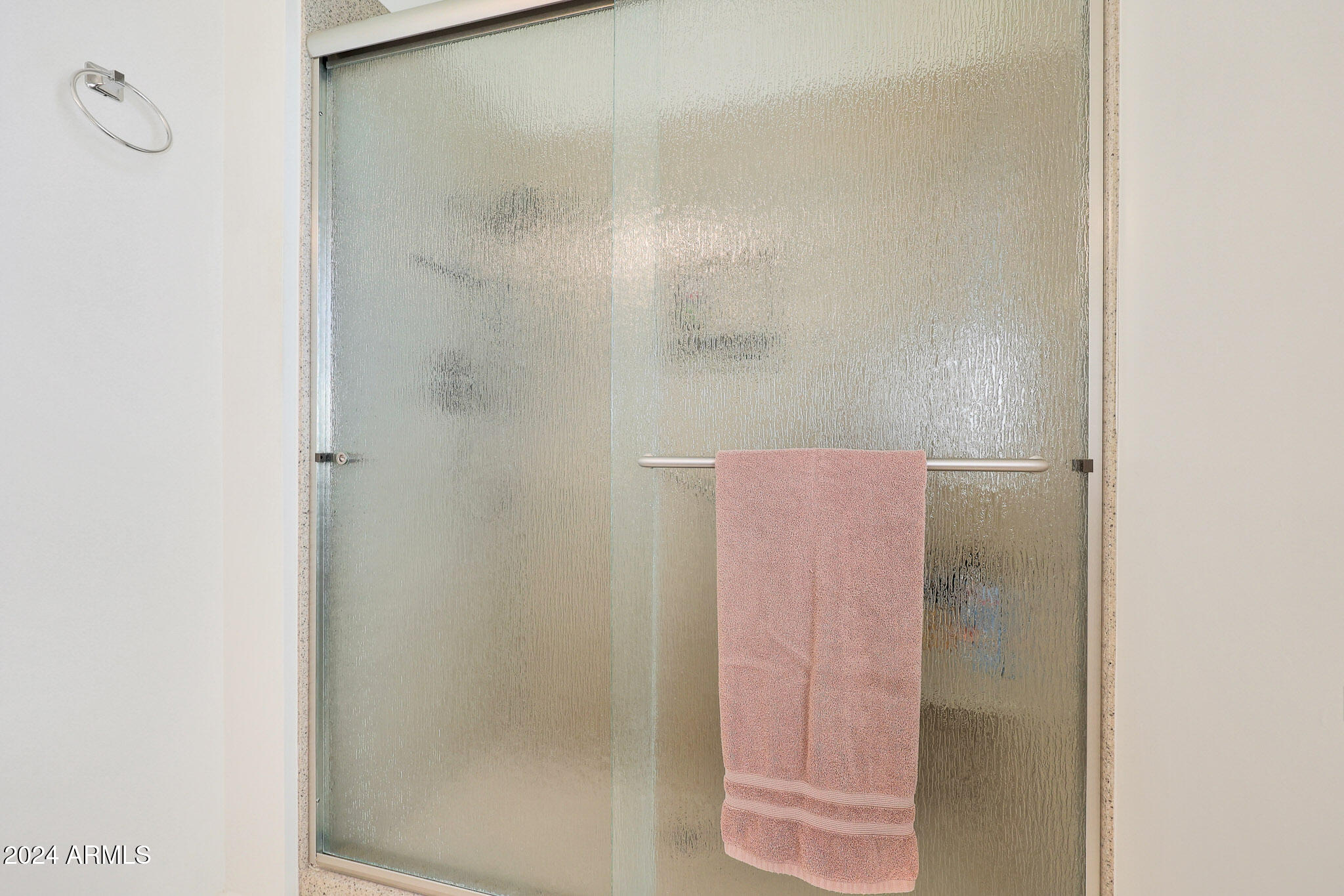 10137 West Mountain View Road Sun City, AZ 85351 - Photo 25 of 34 a bathroom with a shower