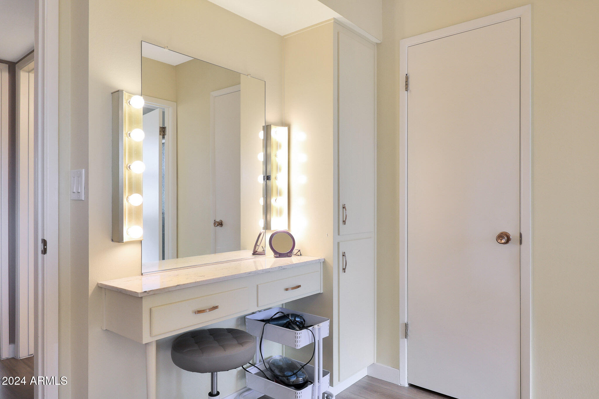 10137 West Mountain View Road Sun City, AZ 85351 - Photo 26 of 34 a bathroom with a sink and a mirror