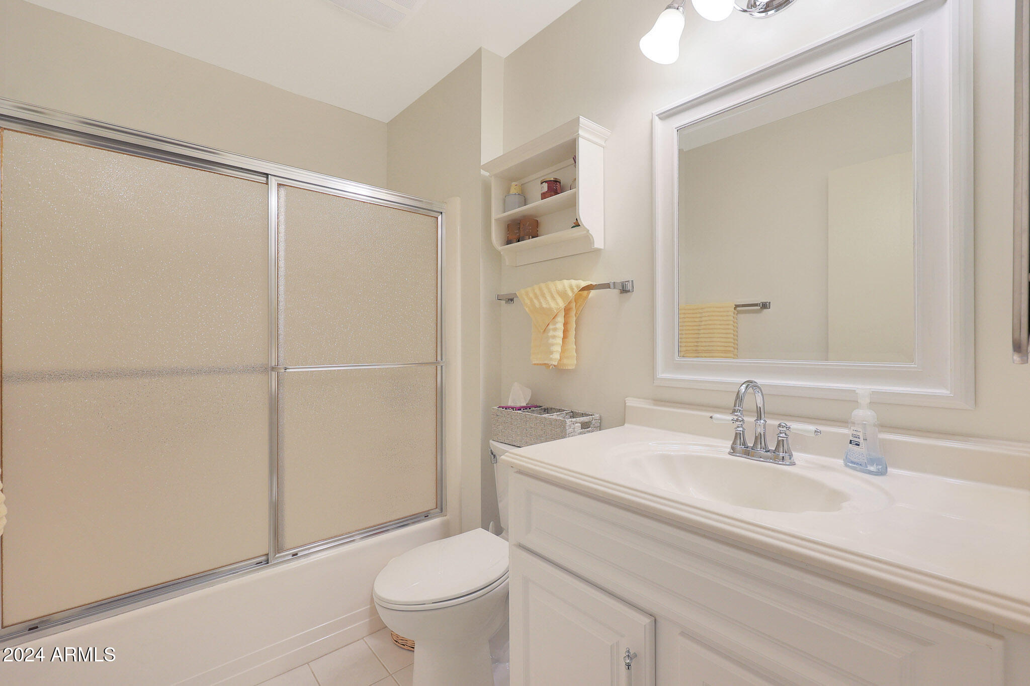 10137 West Mountain View Road Sun City, AZ 85351 - Photo 29 of 34 a bathroom with a sink a toilet and shower