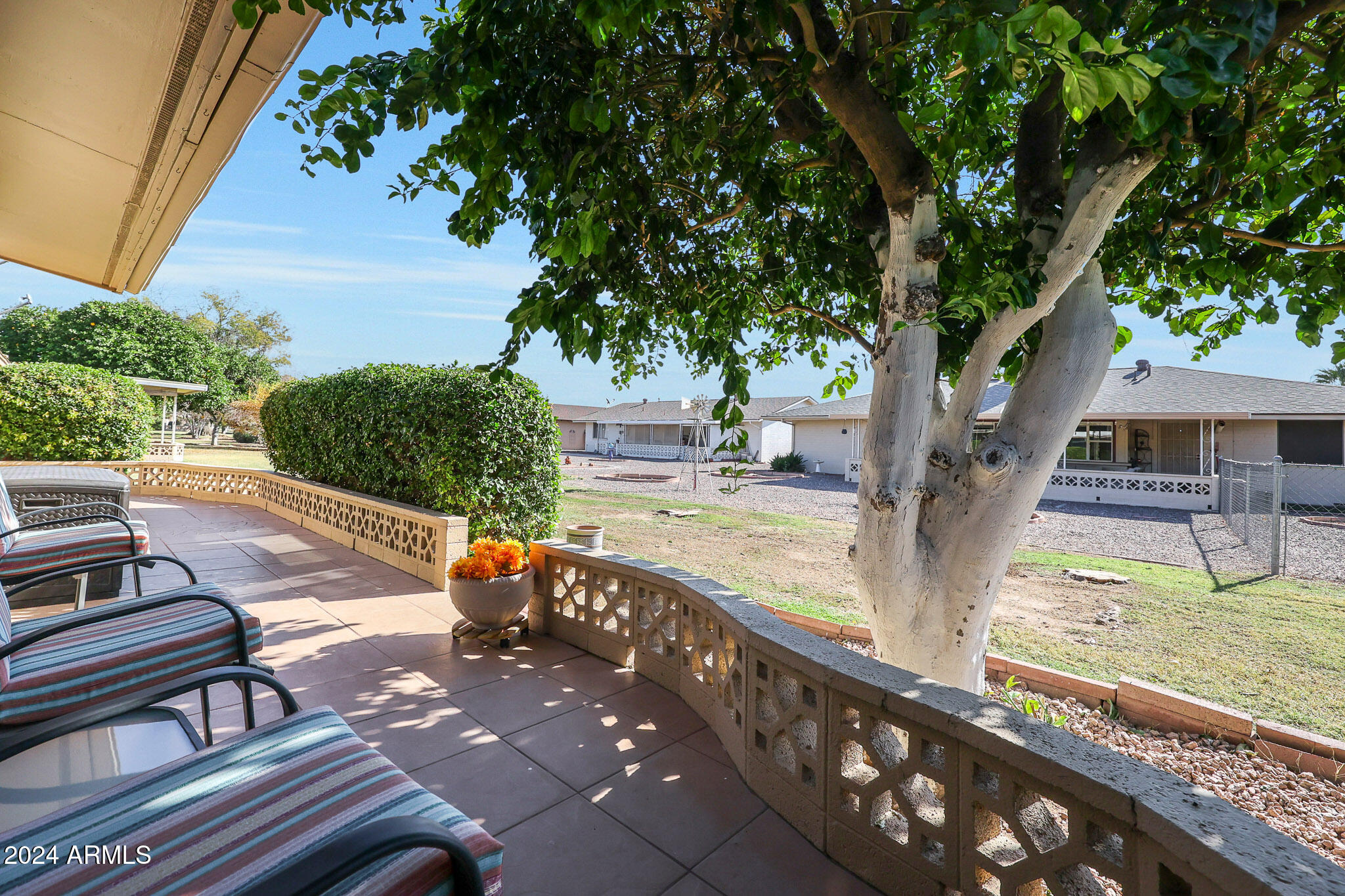 10137 West Mountain View Road Sun City, AZ 85351 - Photo 30 of 34 a view of a swimming pool with a patio