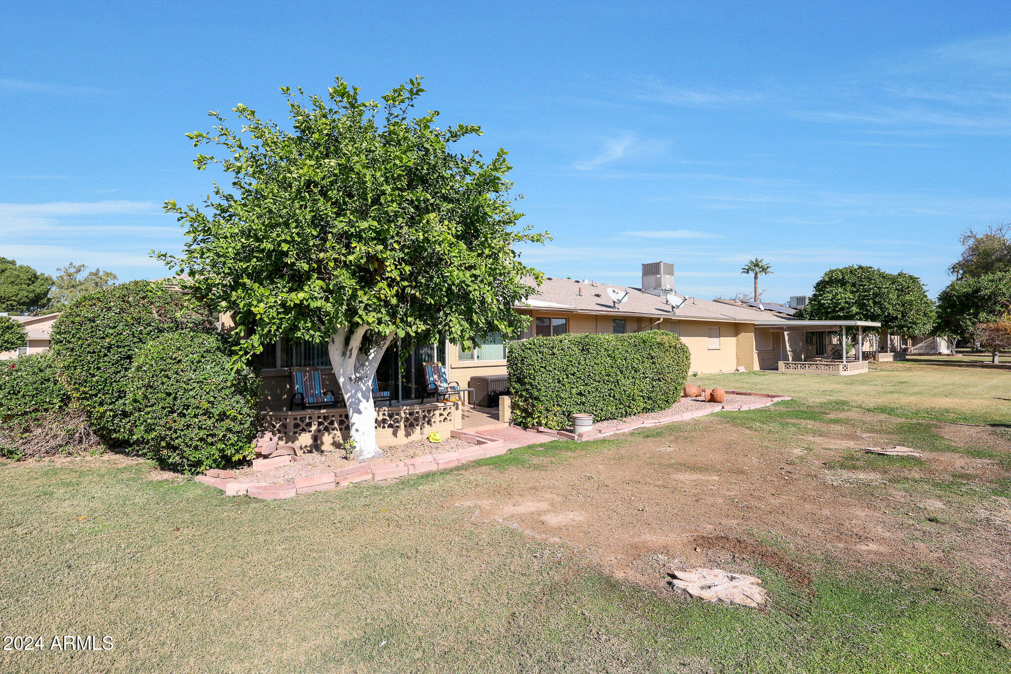 10137 West Mountain View Road Sun City, AZ 85351 - Photo 34 of 34 a view of a house with a yard and sitting area