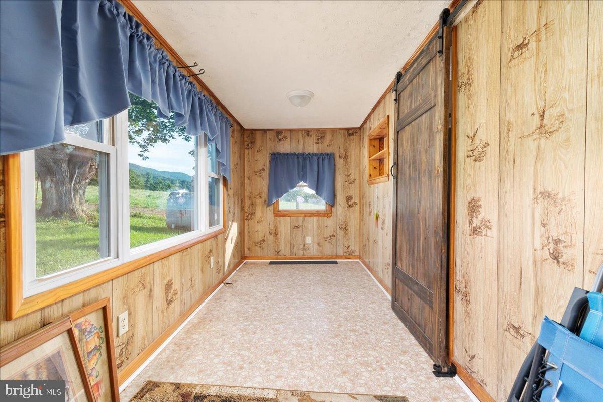 919 Ridge Hollow Road Edinburg, VA 22824 - Photo 18 of 35 Bright and inviting entryway with rustic charm.
