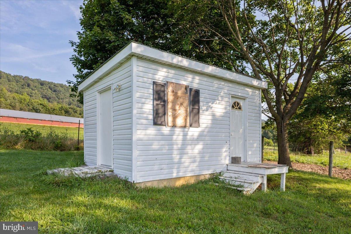 919 Ridge Hollow Road Edinburg, VA 22824 - Photo 22 of 35 Charming white cottage nestled in nature.