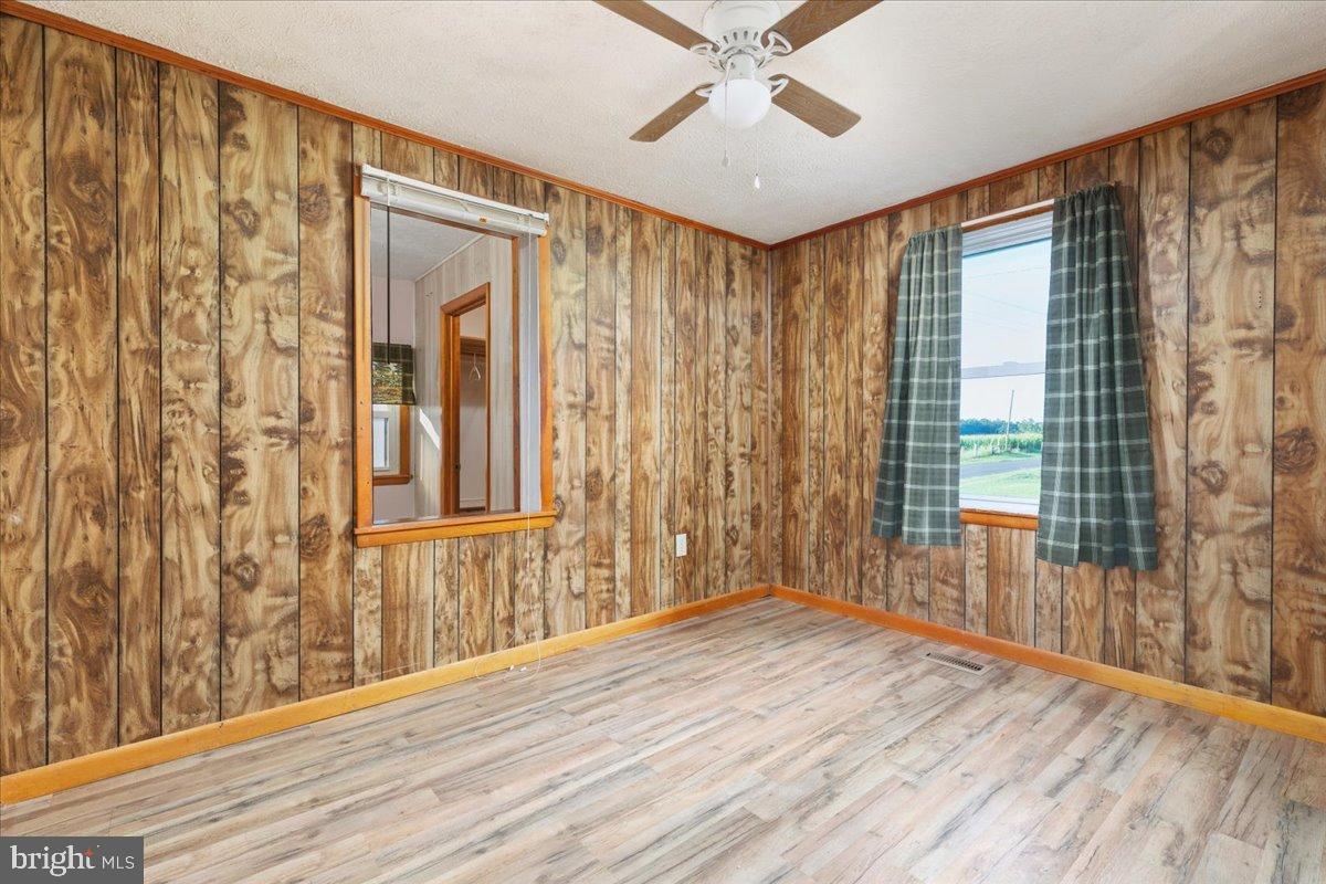 919 Ridge Hollow Road Edinburg, VA 22824 - Photo 34 of 35 Cozy room with rustic wood paneling.