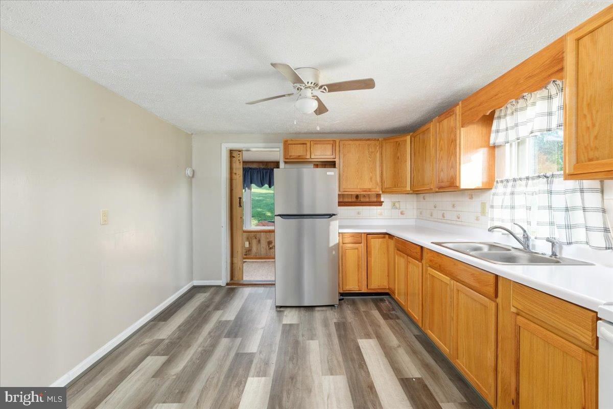 919 Ridge Hollow Road Edinburg, VA 22824 - Photo 6 of 35 Bright and inviting kitchen with modern finishes.