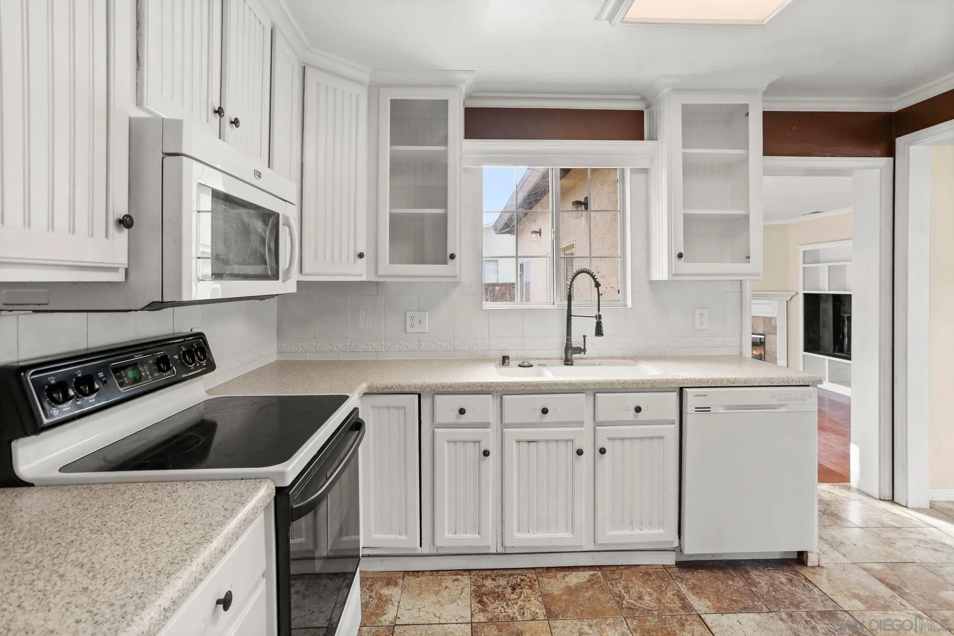 9255 Los Coches Road Lakeside, CA 92040 - Photo 19 of 34 a kitchen with granite countertop white cabinets and stainless steel appliances