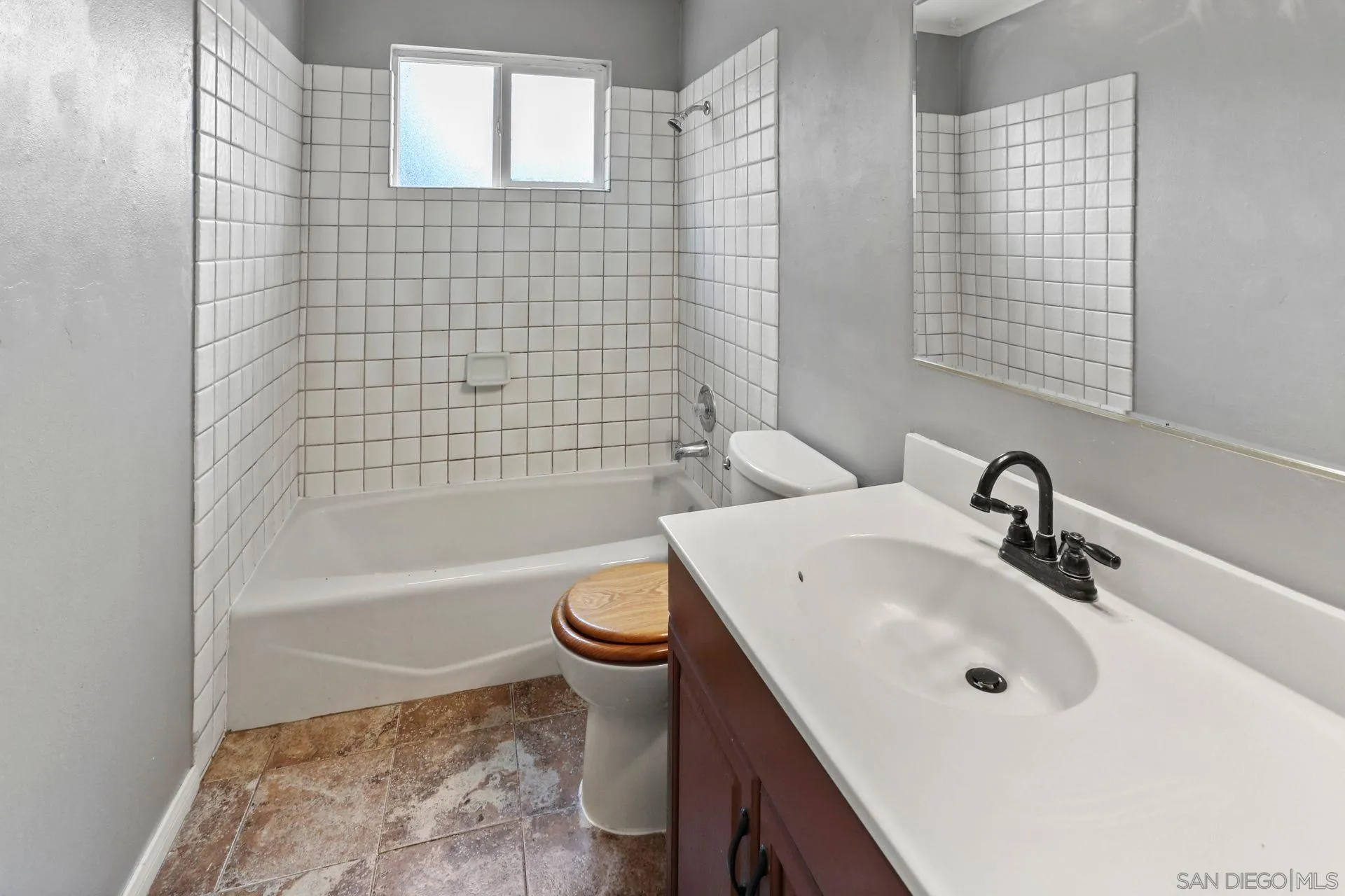 9255 Los Coches Road Lakeside, CA 92040 - Photo 23 of 34 a bathroom with a sink a toilet and bathtub