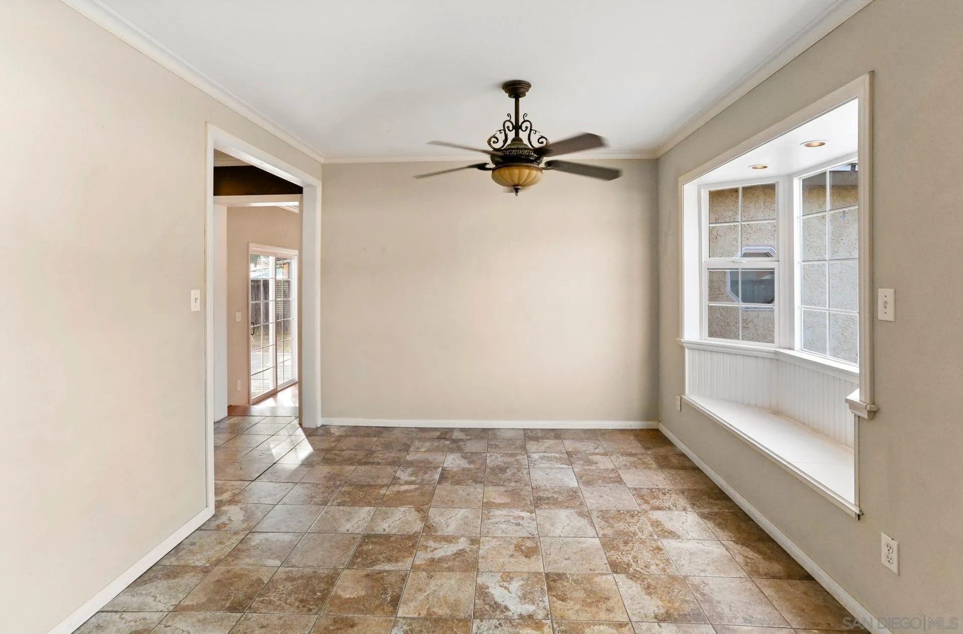 9255 Los Coches Road Lakeside, CA 92040 - Photo 10 of 34 a view of a hallway with a chandelier fan and windows