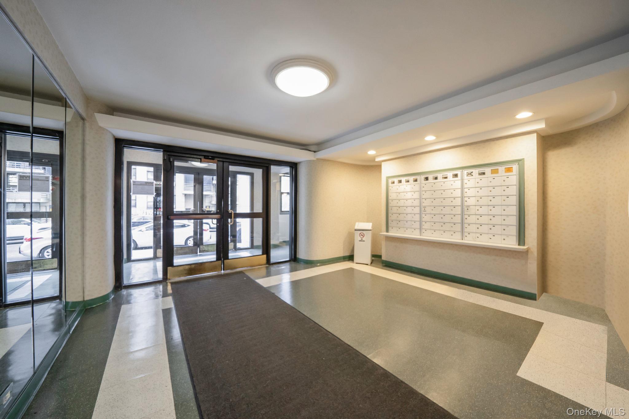 98-33 64th Avenue, Unit 1D Queens, NY 11374 - Photo 5 of 20 a view of an empty room with a window