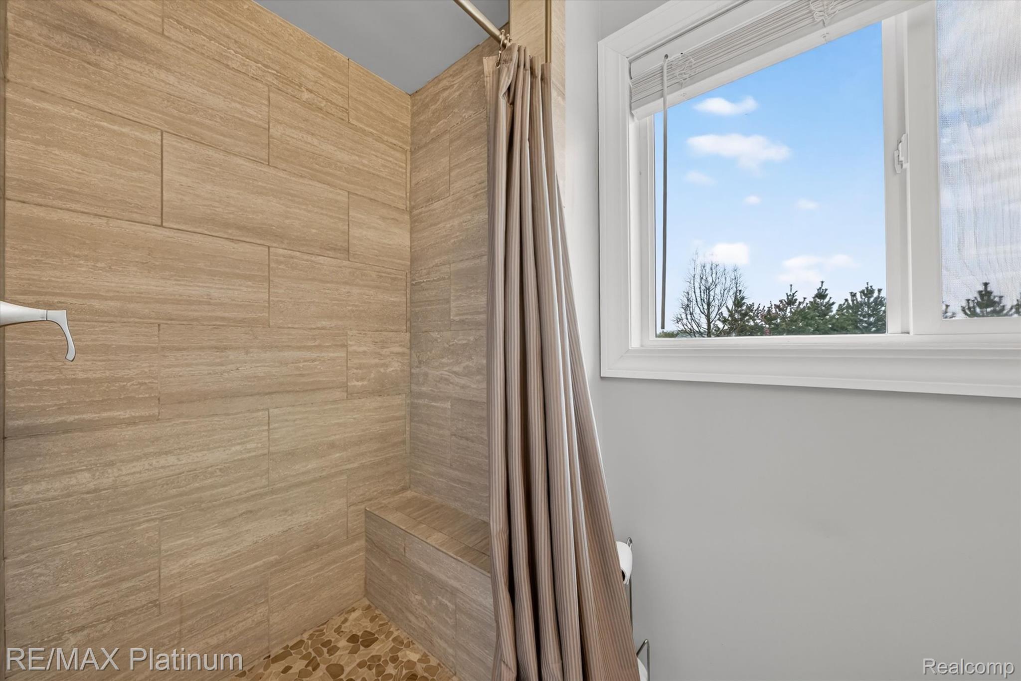 7687 Parshallville Road Fenton, MI 48430 - Photo 6 of 15 Full bathroom with a modern tiled shower stall