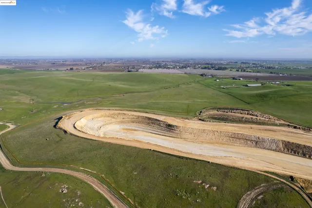 a view of a swimming pool with a lake view and mountain view