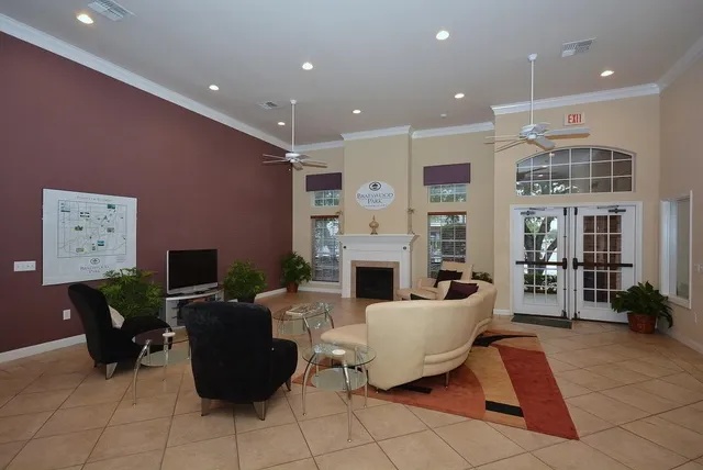 a living room with fireplace furniture and a flat screen tv