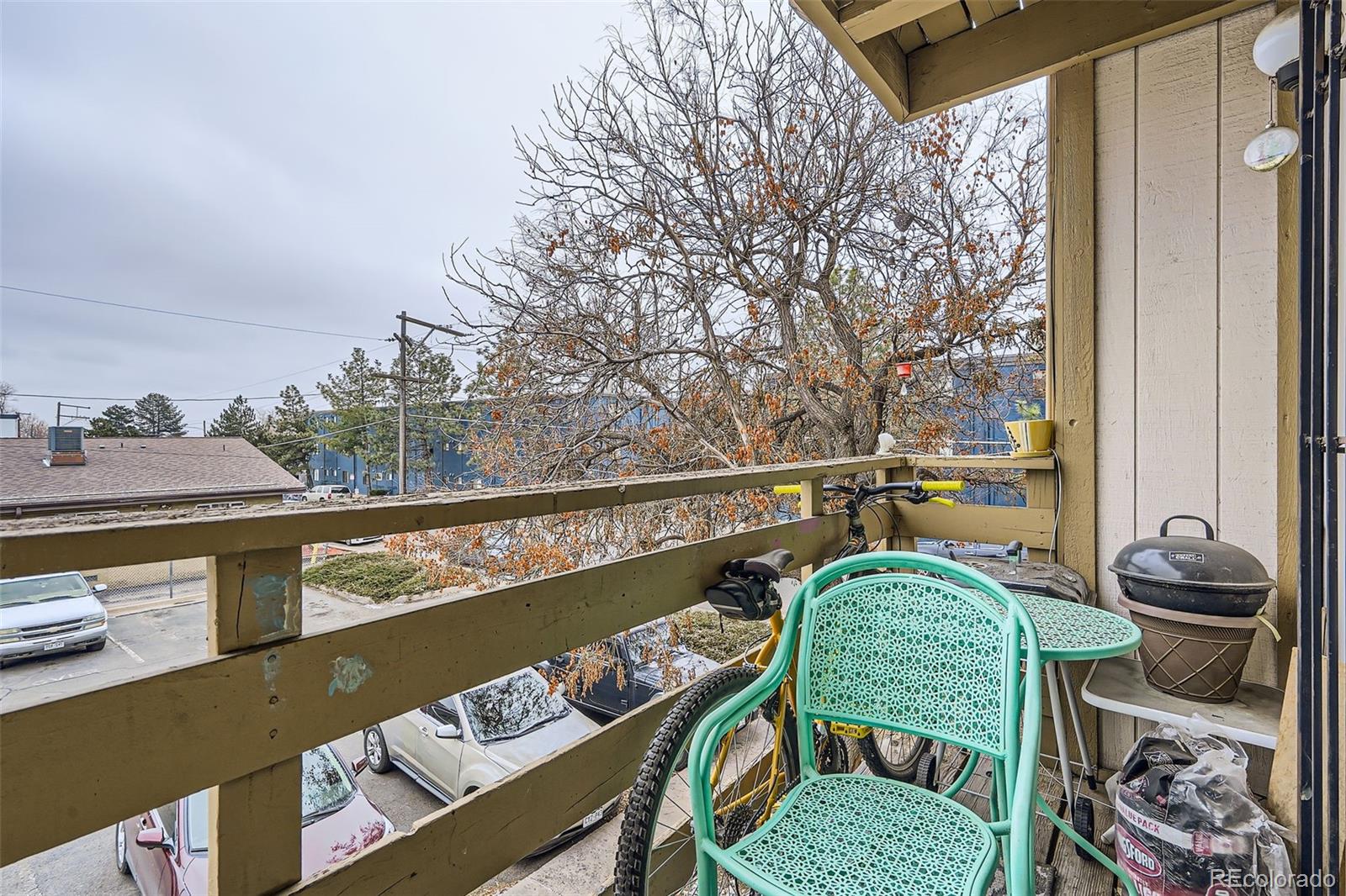 1358 South Irving Street, Unit 53 Denver, CO 80219 - Photo 24 of 28 a balcony with a table and chairs