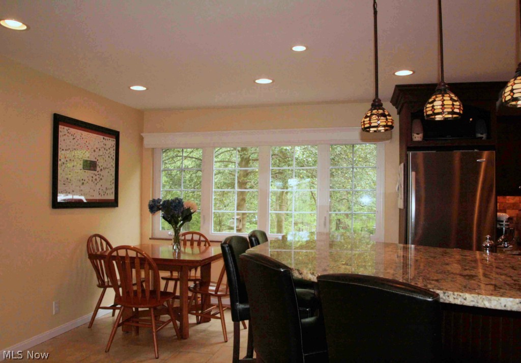 1970 Ridgewood Road Akron, OH 44313 - Photo 8 of 22 The sunny family dining area.