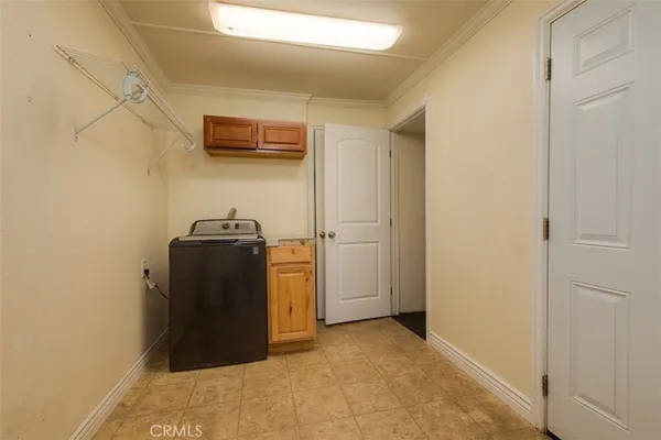 a view of a storage & utility room with washer and dryer