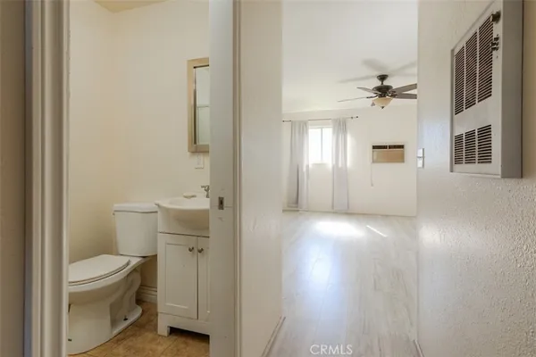 a bathroom with a toilet a sink and shower