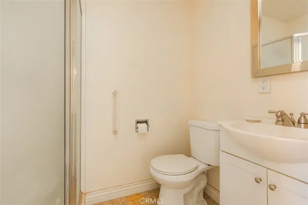 a bathroom with a sink toilet and vanity