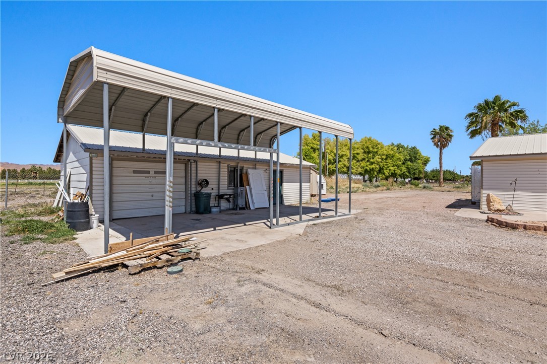 750 Leming Avenue Overton, NV 89040 - Photo 59 of 82 This spacious yard features a practical garage and a convenient carport.