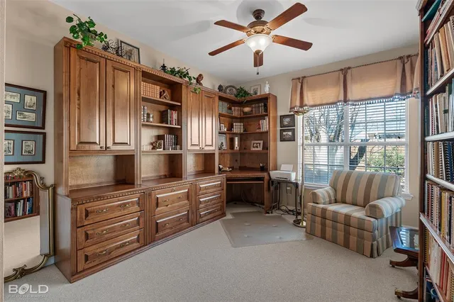 a living room with furniture cabinets and flat screen tv