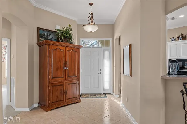 a view of a hallway with entryway door