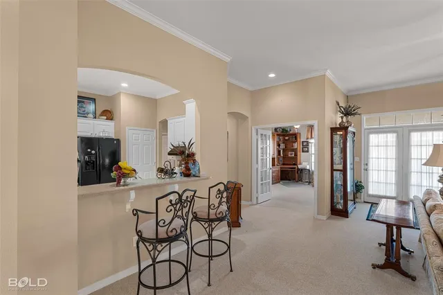 a living room with furniture and a chair