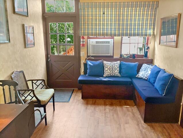 80 Middle Road Palm Beach, FL 33480 - Photo 11 of 33 a living room with furniture and a window